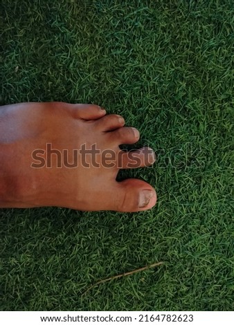 photo of feet on grass
