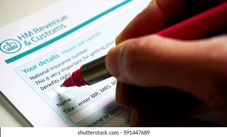 Photo Of Filling In A HM Customs Form A Personal Details For UK Self Assessment Tax And Benefits Right.