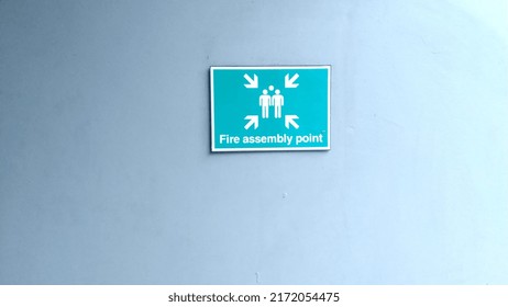 Photo Of A Fire Assembly Point Bulletin Board Mounted On The Wall Of A Building.