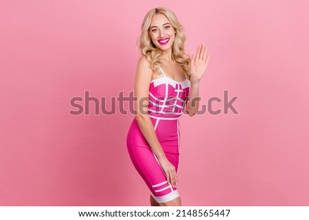 Photo of flirty coquette prom barbie doll wave palm greeting guests wear fancy striped dress isolated pink color background