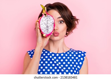 Photo Of Flirty Young Brunette Lady Show Dragon Fruit Blow Kiss Wear Dotted Blouse Isolated On Pink Color Background