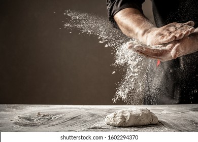 Photo of flour and men hands with flour splash. Cooking bread. Kneading the Dough. - Shutterstock ID 1602294370