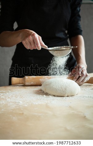 Similar – woman kneading bread dough with her hands