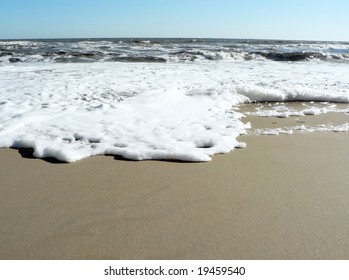 Photo Of A Foamy Surf On Virginia Beach That Includes Copy And Crop Space