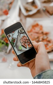 Photo Of Food For Social Networks On The Phone, Junk Food, Pizza, Home Delivery Food. Vertical Image, Happy Time Together, Friends Having Relax Time. Enjoy Communication And Holiday.