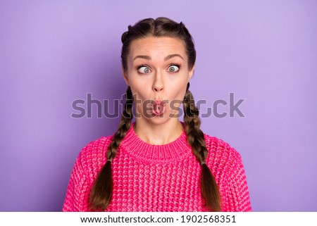Photo of fooling funny pretty crazy woman make funky face good mood isolated on purple color background