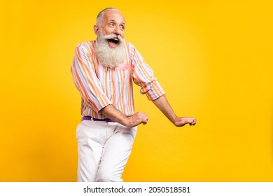 Photo Of Foolish Old Man Dance Feel Young Open Mouth Wear Striped Shirt Isolated Yellow Color Background