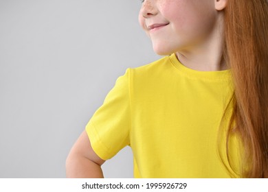 Photo Of A Fragment Of The Sleeve Of A Yellow Children's Dress, A Summer Cotton Dress.