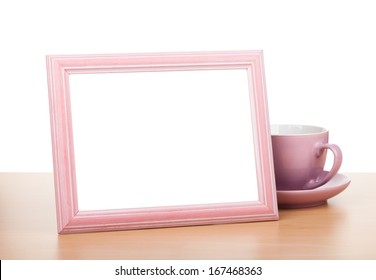 Photo Frame And Coffee Cup On Wooden Table. Isolated On White Background