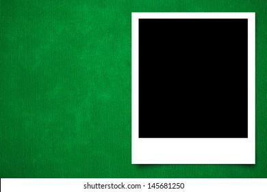 Photo frame on Green carpet background texture