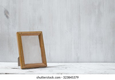 Photo Frame On Old White Table