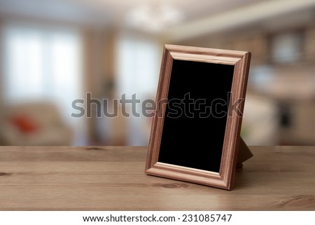 Foto stock de Photo Frame On Wooden Table Living (editar agora