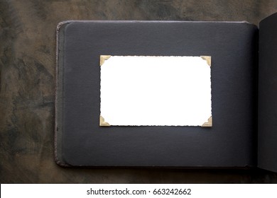 Photo Frame - Real Old Photo With White Blank Space For Copy Photo With Gold Coloured Photo Holder Corners Onto Black Vintage Album Paper Page - Top View Background With Space For Text