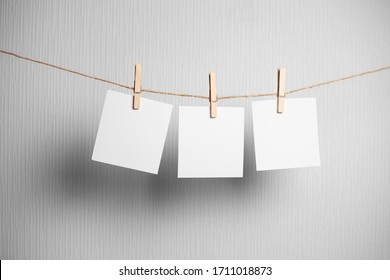 photo frame.Retro photo frames hanging on rope isolated on white background. real photo. three frames - Powered by Shutterstock