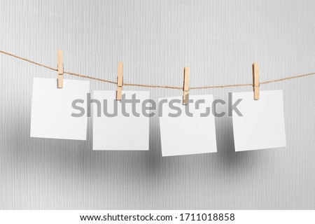 photo  frame.Retro photo frames hanging on rope isolated on white background. real photo.four frames