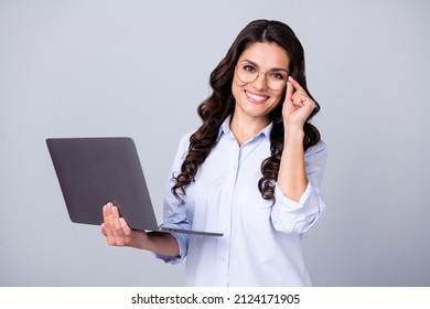 Photo of freelancer distance worker lady hold pc netbook wear glasses blue shirt isolated grey color background