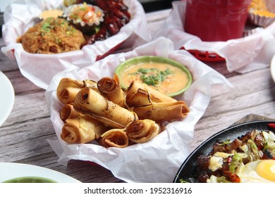 Photo Of Freshly Cooked Filipino Food Called Lumpiang Shanghai Or Fried Ground Pork Meat In Spring Roll Wrapper.