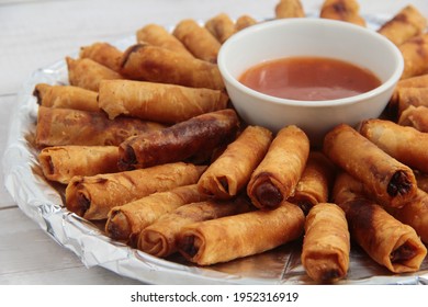 Photo Of Freshly Cooked Filipino Food Called Lumpiang Shanghai Or Fried Ground Pork Meat In Spring Roll Wrapper.