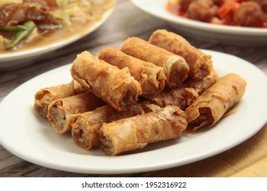 Photo Of Freshly Cooked Filipino Food Called Lumpiang Shanghai Or Fried Ground Pork Meat In Spring Roll Wrapper.