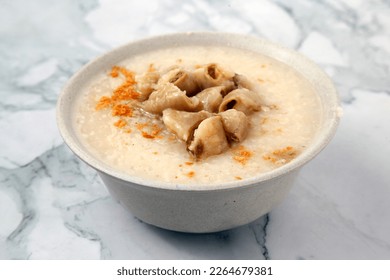 Photo of freshly cooked Filipino food called Goto or Lugaw or rice porridge with beef meat and innards. - Shutterstock ID 2264679381