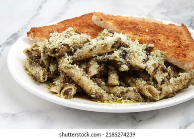 Photo Of Freshly Cooked Pesto Penne Pasta.