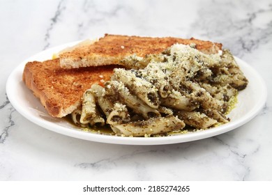 Photo Of Freshly Cooked Pesto Penne Pasta.