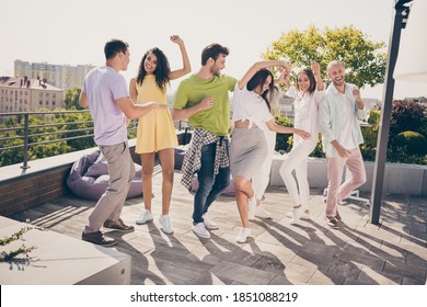 Photo of friendly pretty girls handsome guys have fun dancing party on roof terrace outside