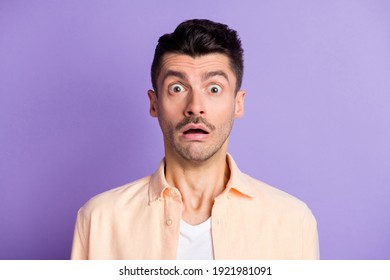 Photo Of Frightened Horrified Guy Staring Open Mouth Wear Beige Shirt Isolated Violet Color Background