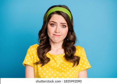 Photo of frustrated girl shrug shoulders feel sorry wear polka-dot clothes isolated over blue color background. - Shutterstock ID 1835992090