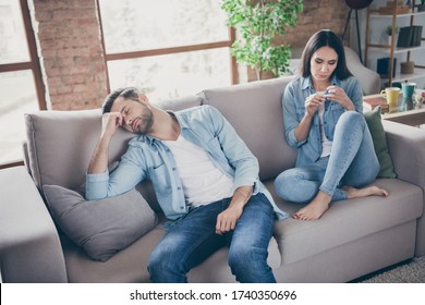 Photo of frustrated quarantine couple sit couch feel boring man sleep woman look manicure in house indoors - Powered by Shutterstock