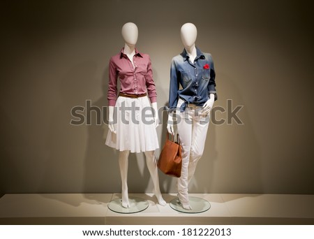 Photo full-length female clothes on a two mannequin with bag
