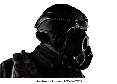 Photo of a fully equipped soldier in black armor tactical vest, gas mask, gloves and helmet standing isolated on white background closeup profile view. - Powered by Shutterstock