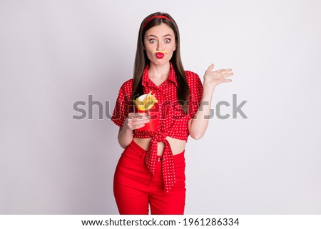 Photo of funky childish girl hold box french fries fake mustache pout lips wear red dotted blouse isolated grey color background