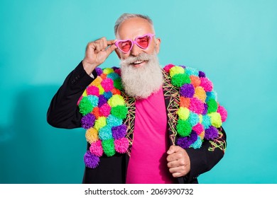 Photo of funky cool senior hipster wear handmade pop-pom blazer arm eyeglasses smiling isolated teal color background - Shutterstock ID 2069390732