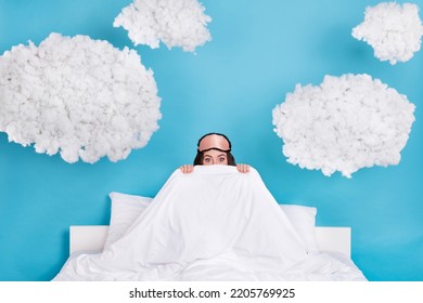 Photo of funky excited woman dressed pink pajama mask sitting bed covering warm blanket isolated blue color background - Shutterstock ID 2205769925
