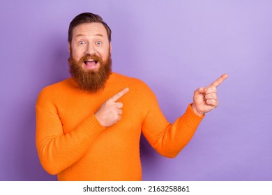 Photo Of Funky Foxy Young Guy Presenting Black Friday Poster Ad Point Fingers Empty Space Isolated On Violet Color Background