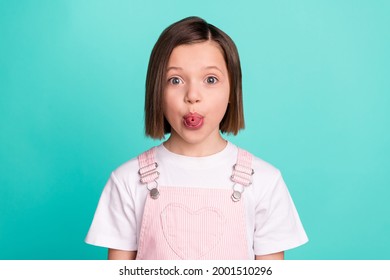 Photo Of Funky Happy Cheerful Small Girl Good Mood Make Funny Face Tongue Isolated On Teal Color Background