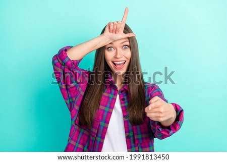 Photo of funky long hairdo young lady show loser you wear checkered shirt isolated on vivid teal color background