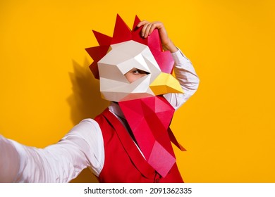 Photo Of Funky Weird Guy Hold Camera Take Festive Selfie Wear Cock Mask Red Suit Isolated Yellow Color Background