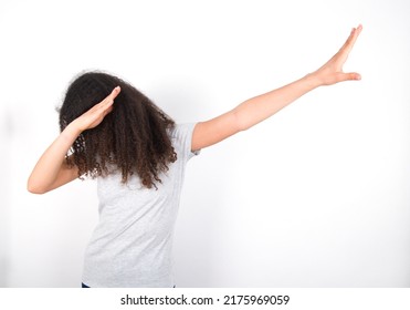 Photo Of Funky Young Beautiful Brunette Teen Girl Wearing Grey T-shirt Over White Wall Show Disco Move Dab