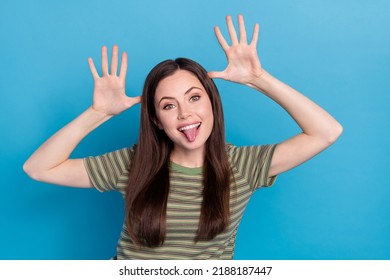 Photo of funky young brunette lady play wear striped t-shirt isolated on blue color background - Shutterstock ID 2188187447