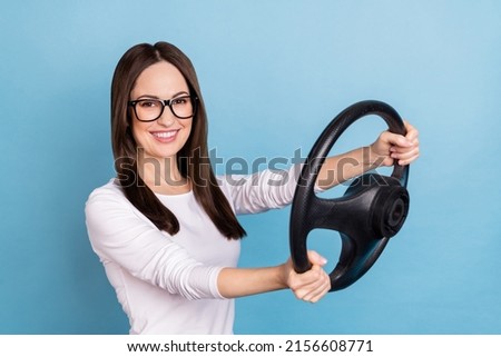 Photo of funky young brunette lady drive car wear eyewear white shirt isolated on blue color background