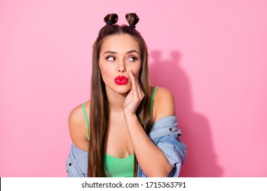 Photo of funky youngster lady hold arm near mouth say tell news fresh gossips rumors sly person wear denim jacket green crop top isolated pastel pink color background