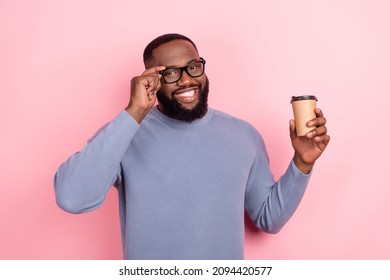 Photo of funny afro guy wear grey pullover arm glasses holding coffee cup isolated pink color background
