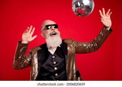 Photo of funny beard elder magician man dance look disco ball wear gold jacket eyewear isolated on red color background