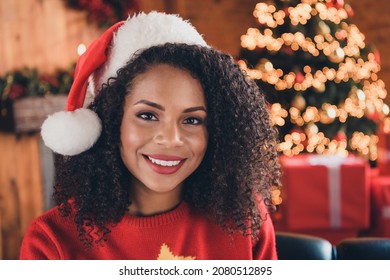 Photo of funny charming dark skin woman dressed red sweater headwear smiling indoors house home room - Powered by Shutterstock