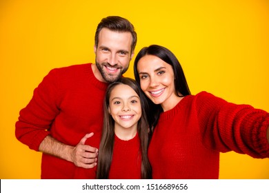 Photo Of Funny Cheerful Cute Nice Family With Day Mom Taking Selfie And Dad Hugging His Daughter Wearing Red Sweater People Together Isolated Vibrant Yellow Color Background