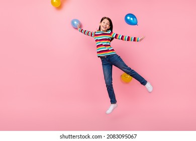 Photo Of Funny Crazy Cheerful Lovely Lady Jump Up Have Birthday Party Fun Wear Striped Shirt Isolated Pink Color Background