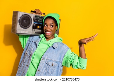 Photo Of Funny Excited Person Carry Vintage Boom Box Hand Look Empty Space Isolated On Yellow Color Background