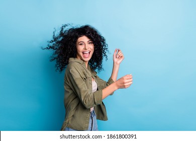 Photo of funny excited person enjoy dancing open mouth hair flying isolated on blue color background